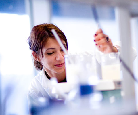 Female researcher working in a lab.