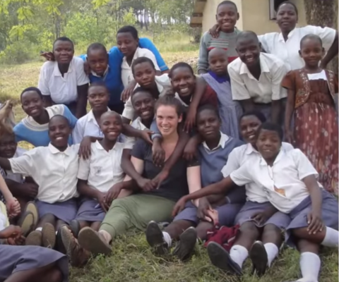 QEScholar Sarah Crawford with children in Uganda