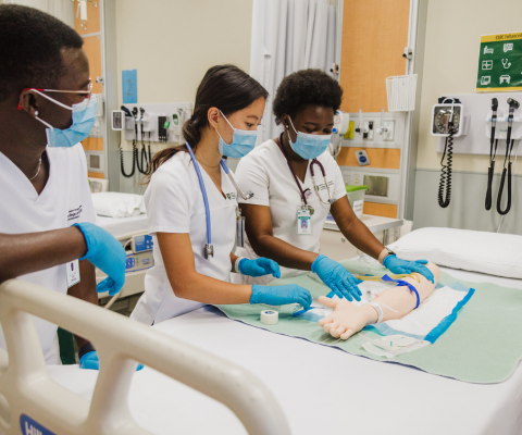 Nursing students in a practice lab